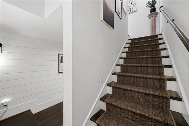 an aerial view of a house with garden space and street view