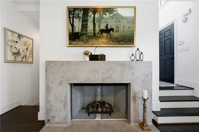 a dining room with furniture and wooden floor