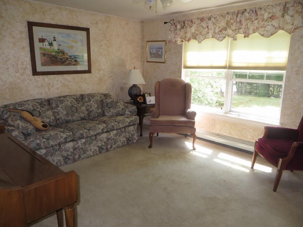 650 Townhouse Road East Waterboro, ME 04030 - Photo 5 of 19 Well kept living room with carpeted...