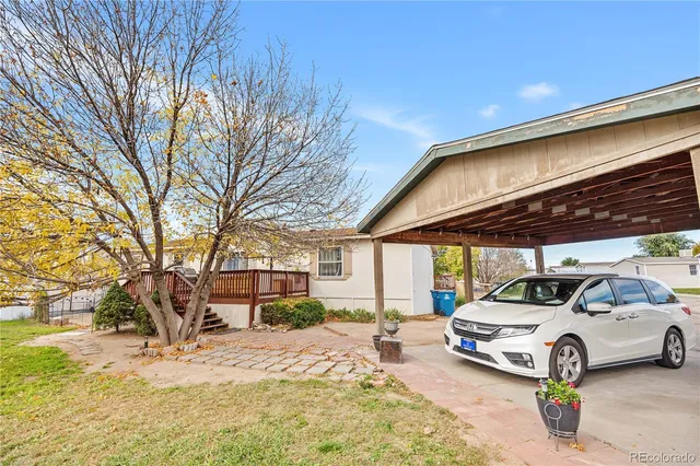 a view of a cars park in front of house