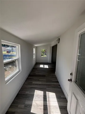 a view of an empty room and window