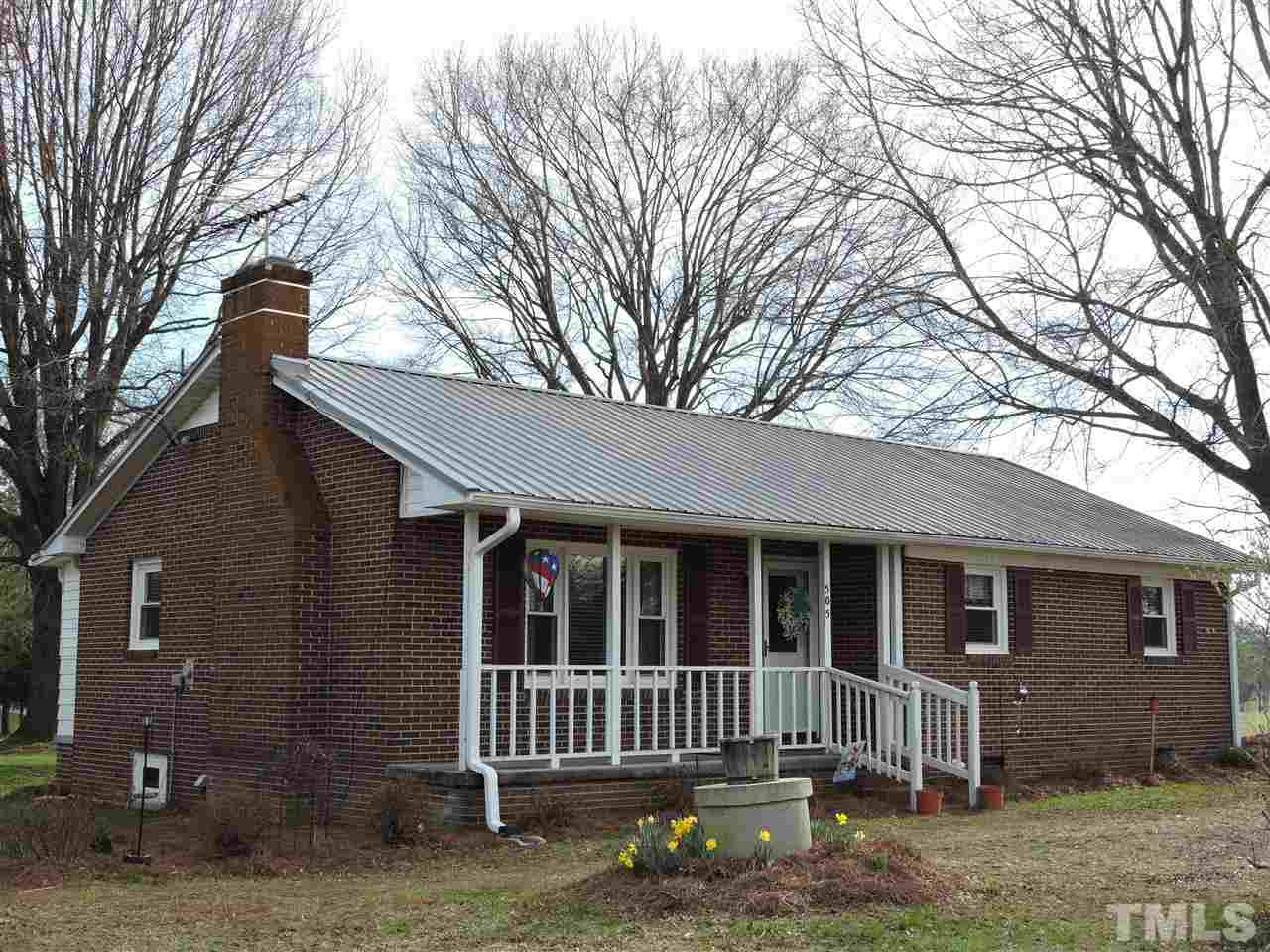 505 Robertson Road Roxboro, NC 27574 - Photo 1 of 16 a view of a house with a yard