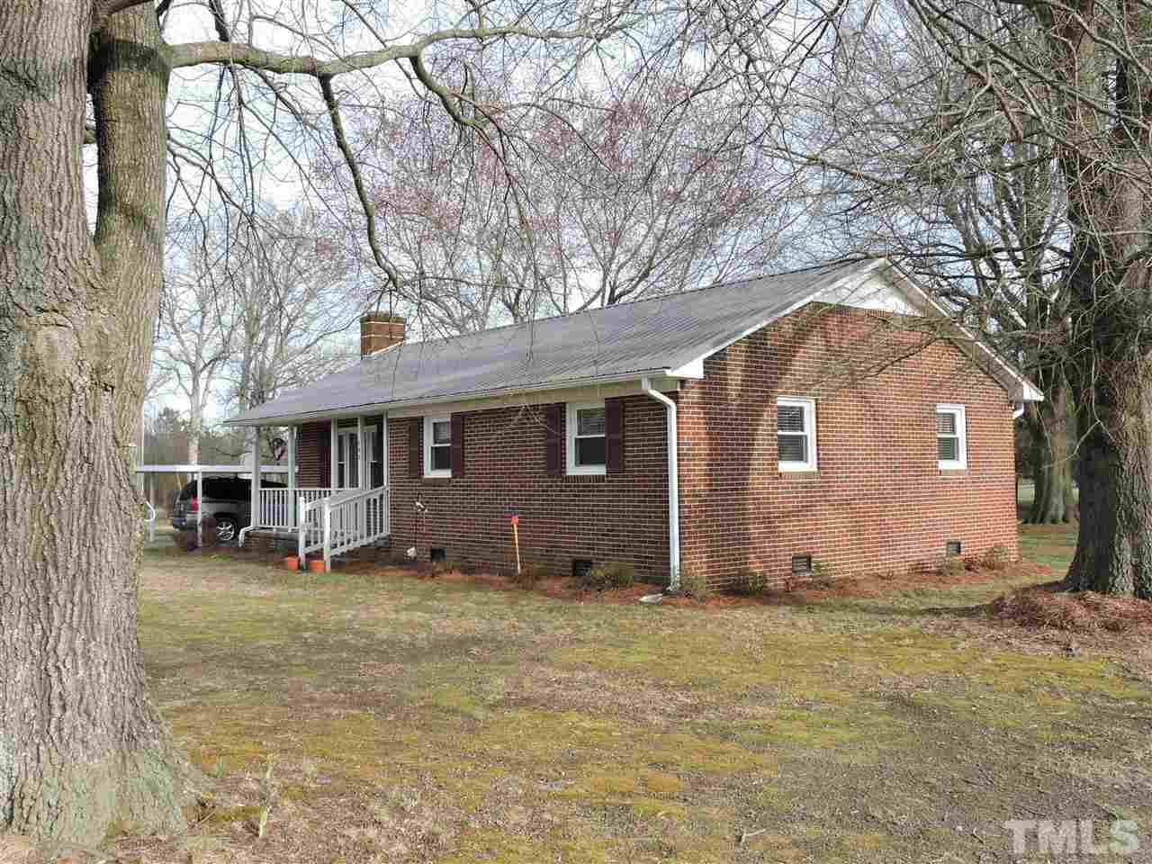 505 Robertson Road Roxboro, NC 27574 - Photo 11 of 16 a view of a house with backyard