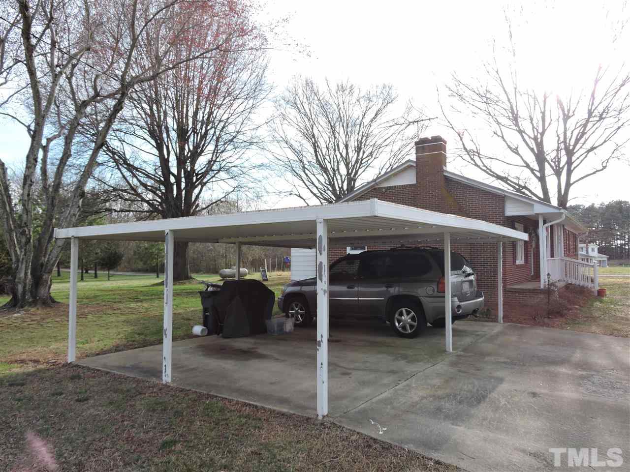 505 Robertson Road Roxboro, NC 27574 - Photo 12 of 16 a view of a car parked in front of house