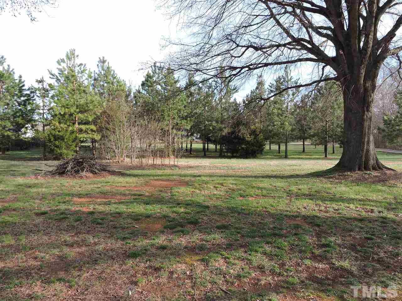 505 Robertson Road Roxboro, NC 27574 - Photo 14 of 16 a view of outdoor space with trees all around