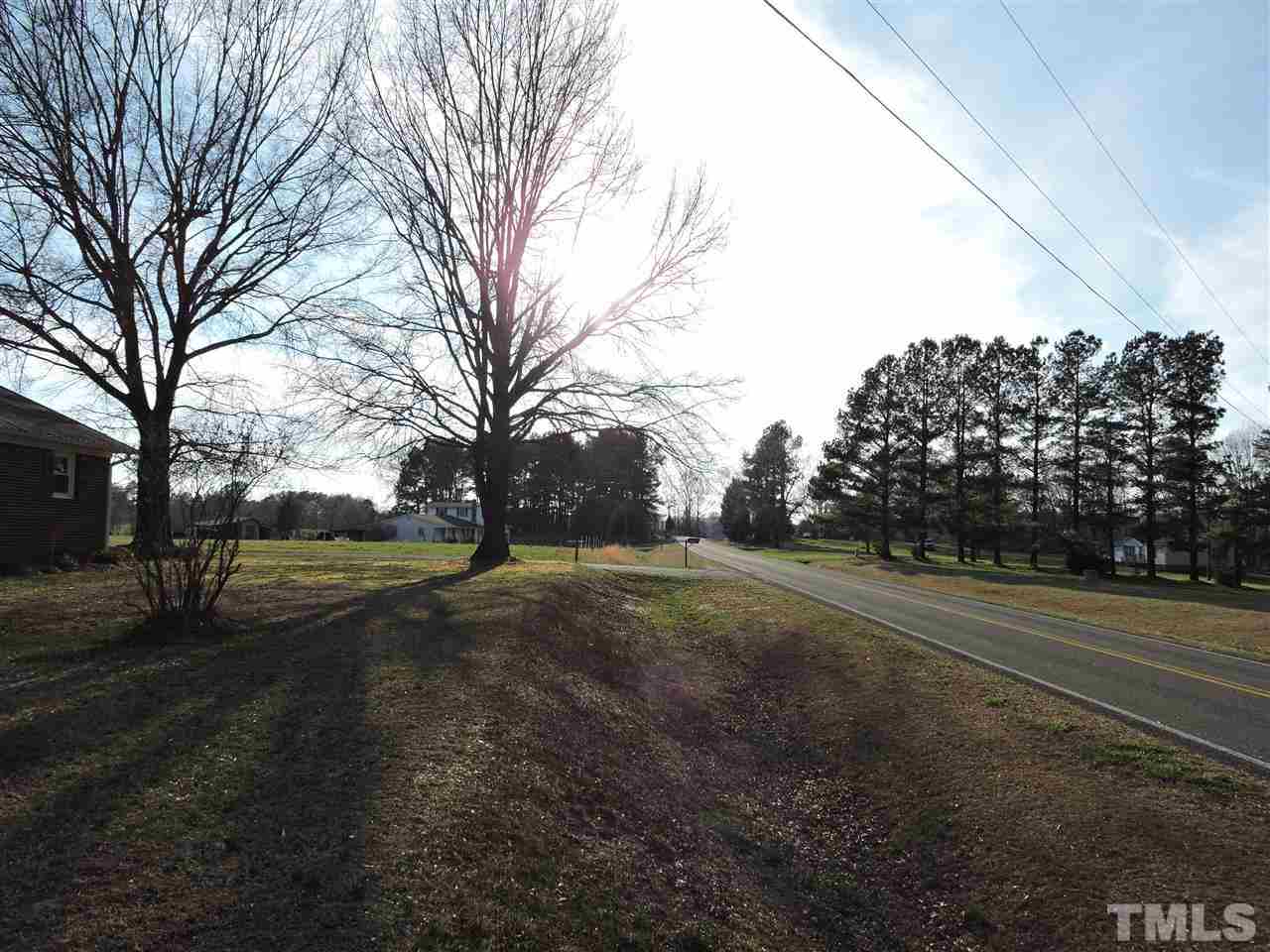 505 Robertson Road Roxboro, NC 27574 - Photo 15 of 16 a view of dirt yard with large trees