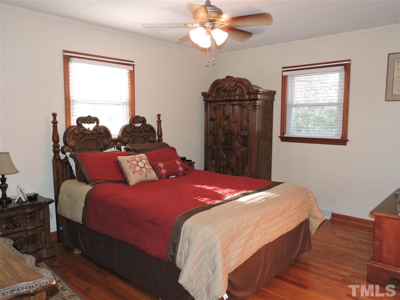 505 Robertson Road Roxboro, NC 27574 - Photo 5 of 16 a bedroom with bed and window