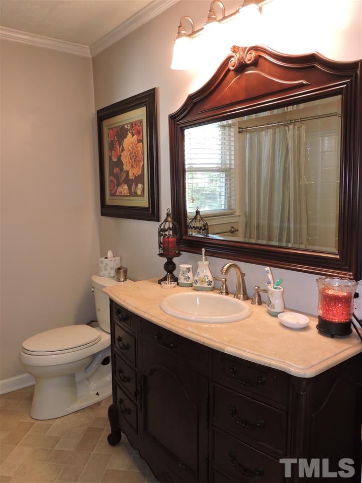 505 Robertson Road Roxboro, NC 27574 - Photo 6 of 16 a bathroom with a sink and a toilet