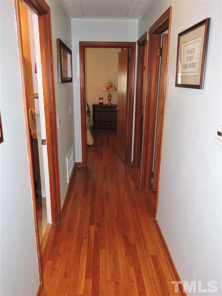 505 Robertson Road Roxboro, NC 27574 - Photo 8 of 16 a view of a hallway and wooden floor