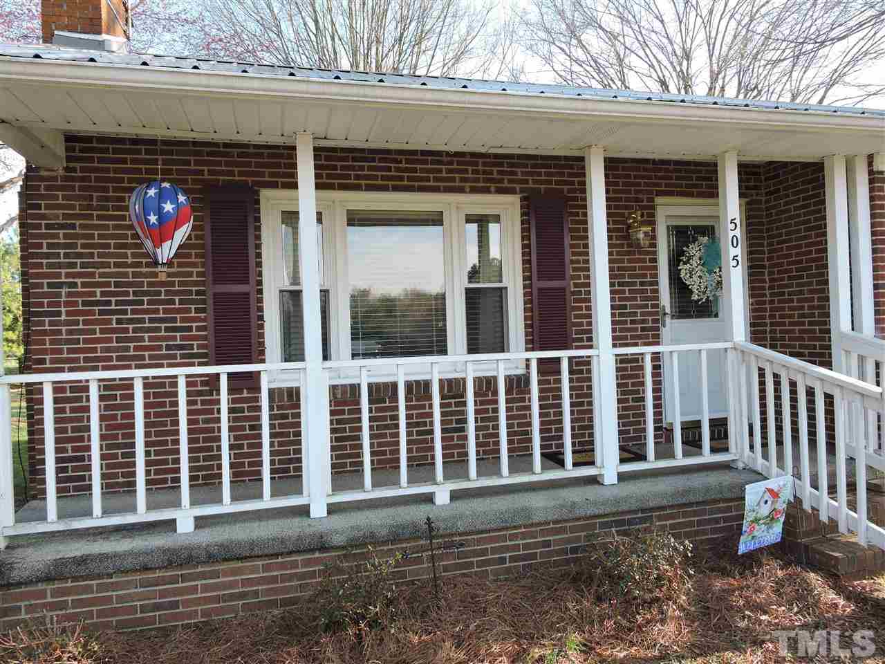 505 Robertson Road Roxboro, NC 27574 - Photo 9 of 16 a front view of a house with a yard