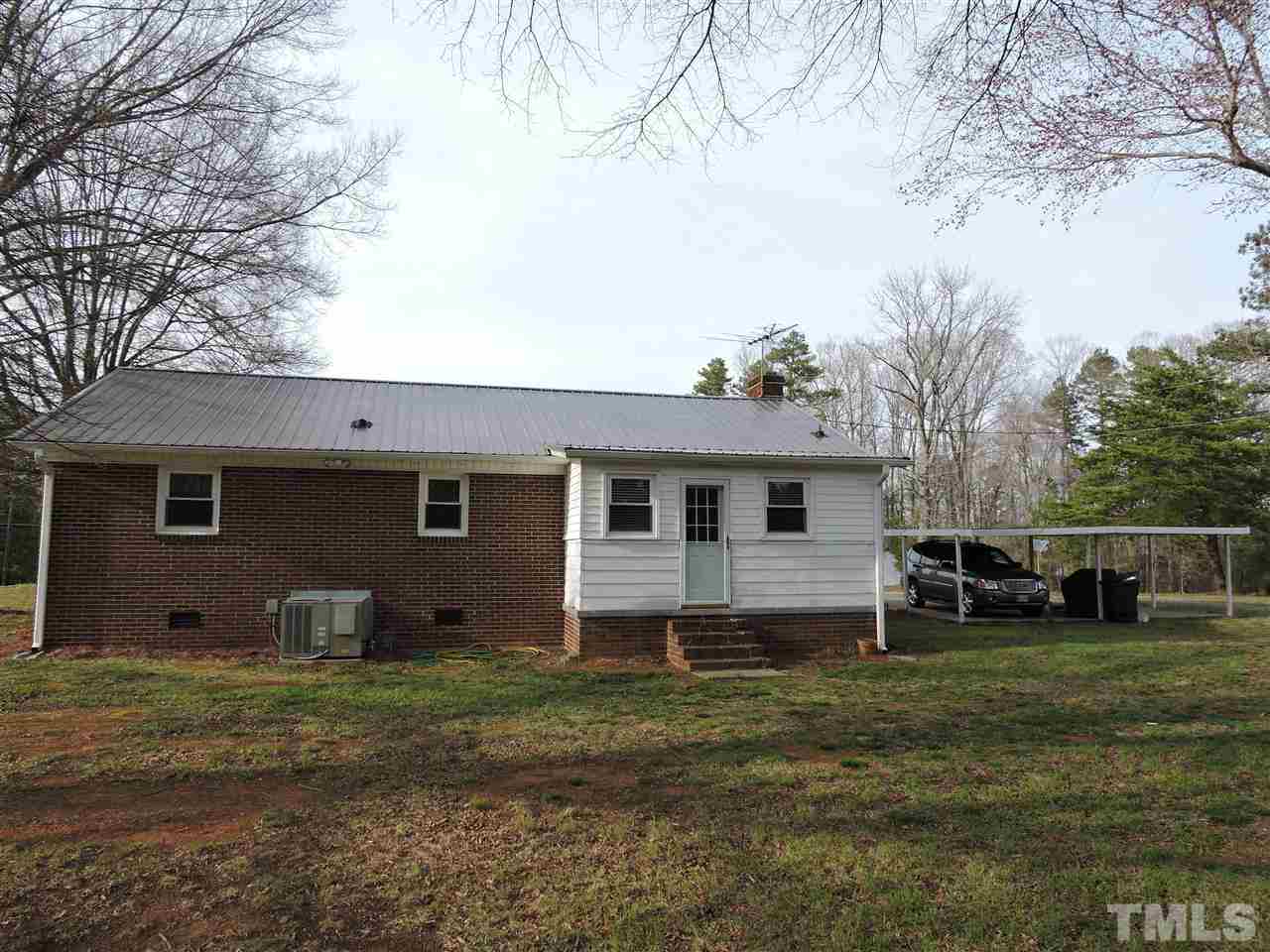 505 Robertson Road Roxboro, NC 27574 - Photo 10 of 16 a view of a house with a yard