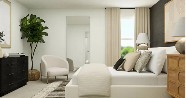 a bedroom with furniture and a potted plant