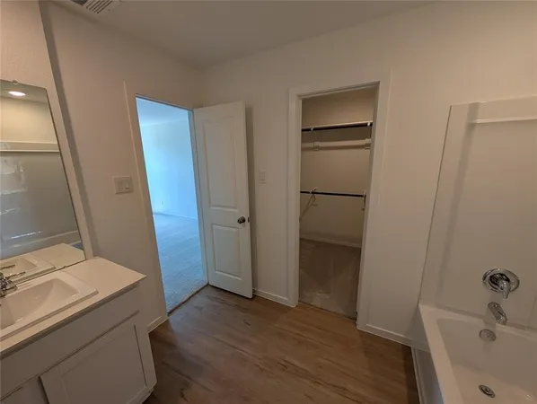 a bathroom with a sink and a tub