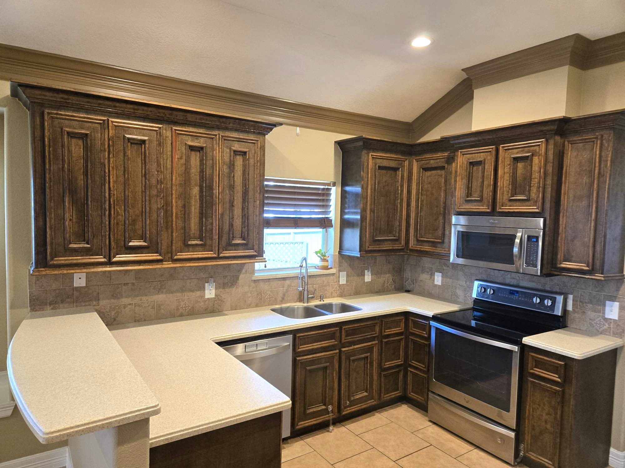 306 Masterson Street Arcola, TX 77583 - Photo 8 of 28 a kitchen with a sink cabinets and window