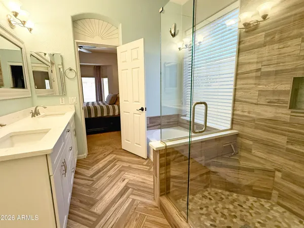 a bathroom with a sink and a mirror