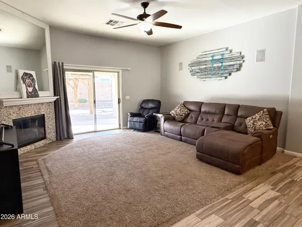 a spacious bedroom with a bed couch and a window