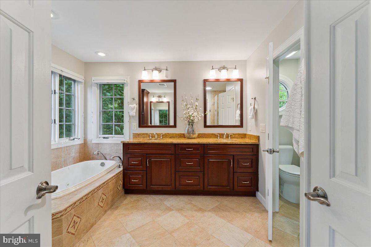 7411 Union Ridge Road Clifton, VA 20124 - Photo 32 of 86 Double vanity & handsome tile flooring