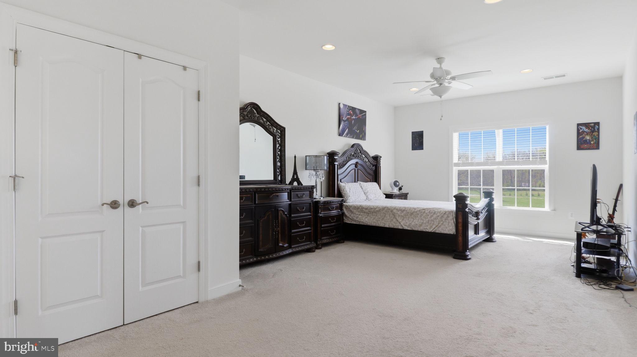 11502 Aden Road Nokesville, VA 20181 - Photo 58 of 106 a bedroom room with furniture and a ceiling fan