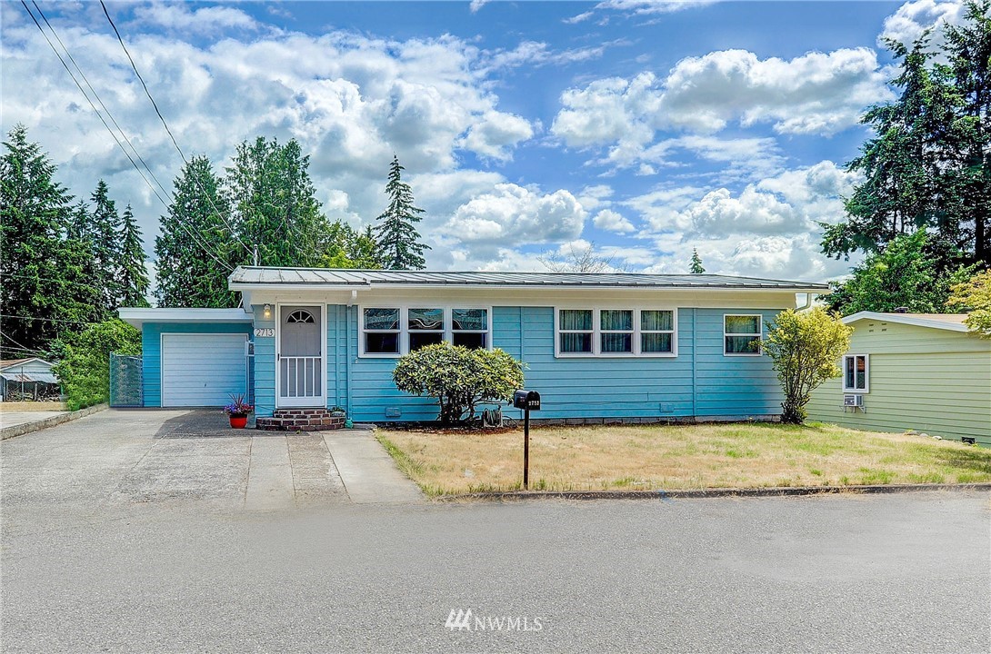 2713 Northeast 6th Place Renton, WA 98056 - Photo 22 of 22 a view of a house with a patio