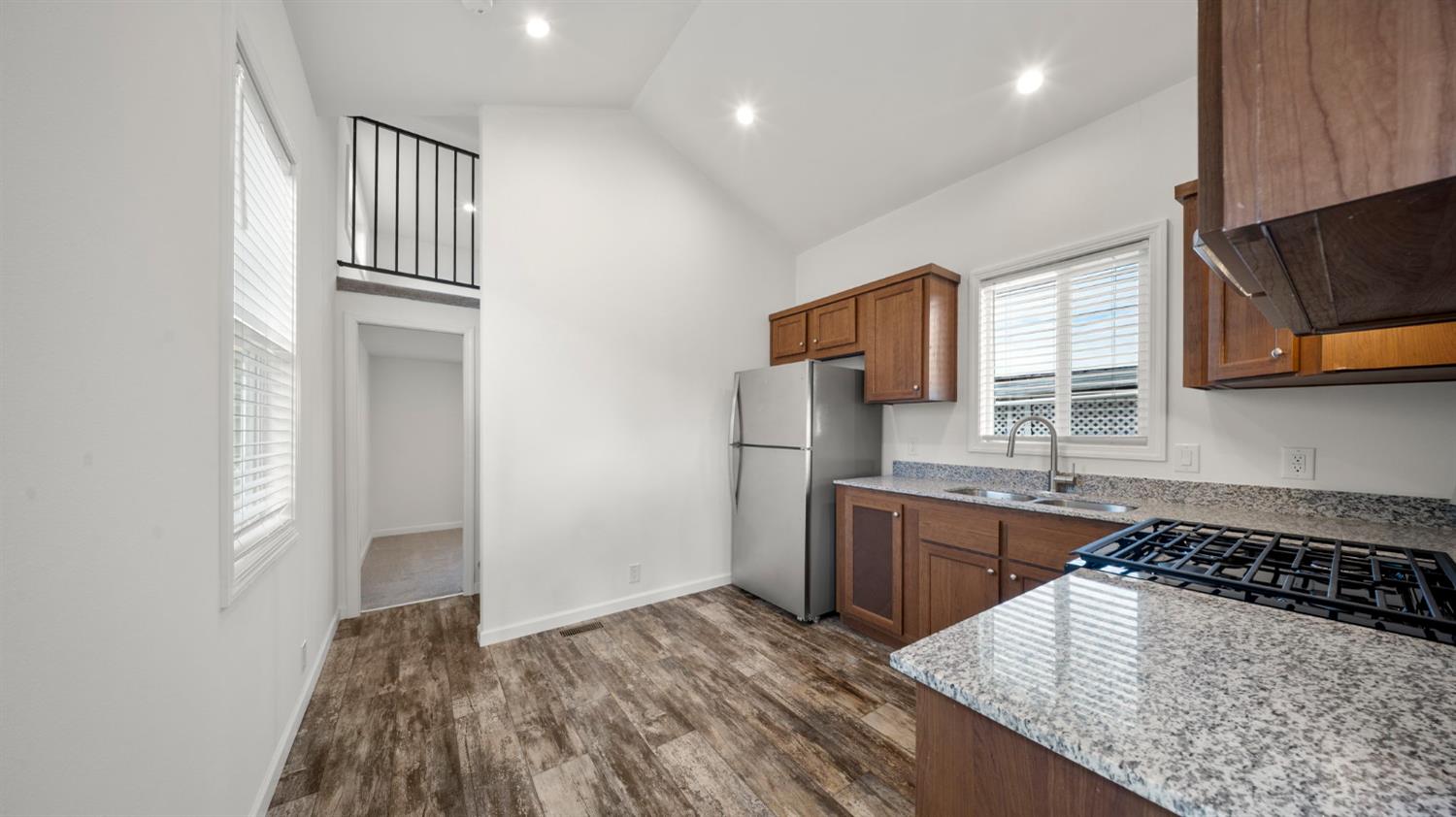 2784 Monterey Road, Unit 48A San Jose, CA 95111 - Photo 6 of 15 a kitchen with stainless steel appliances granite countertop a sink stove and refrigerator