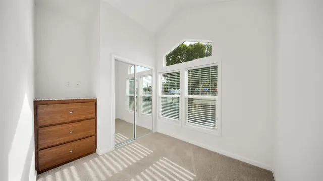 a view of a bedroom with windows