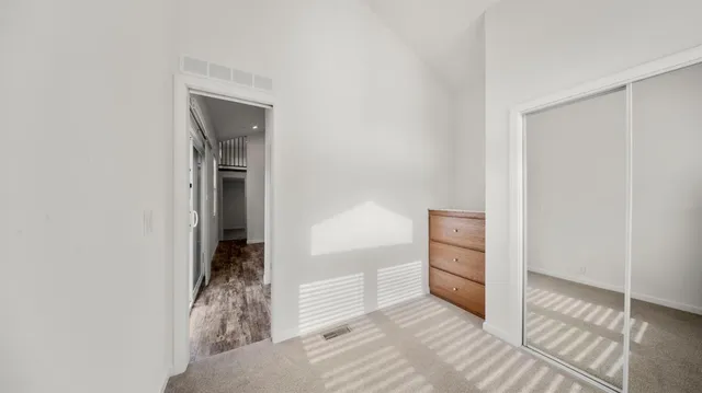 a view of an empty room and fire place