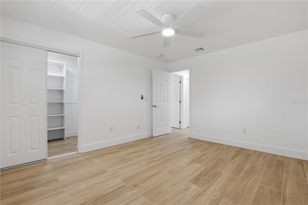 4460 Oakley Street Punta Gorda, FL 33980 - Photo 11 of 18 wooden floor in an empty room