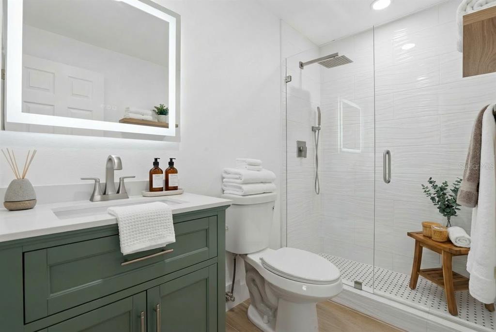 4460 Oakley Street Punta Gorda, FL 33980 - Photo 14 of 18 a bathroom with a sink toilet and shower
