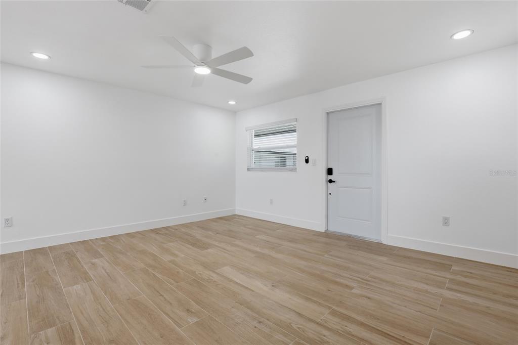 4460 Oakley Street Punta Gorda, FL 33980 - Photo 3 of 18 wooden floor in an empty room