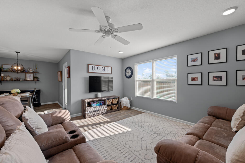 969 Merganser Way Crestview, FL 32539 - Photo 26 of 44 a living room with furniture and a flat screen tv