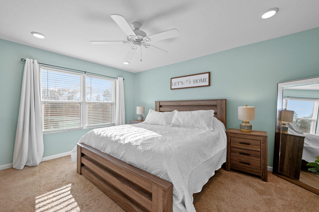 969 Merganser Way Crestview, FL 32539 - Photo 27 of 44 a bedroom with a bed and a window