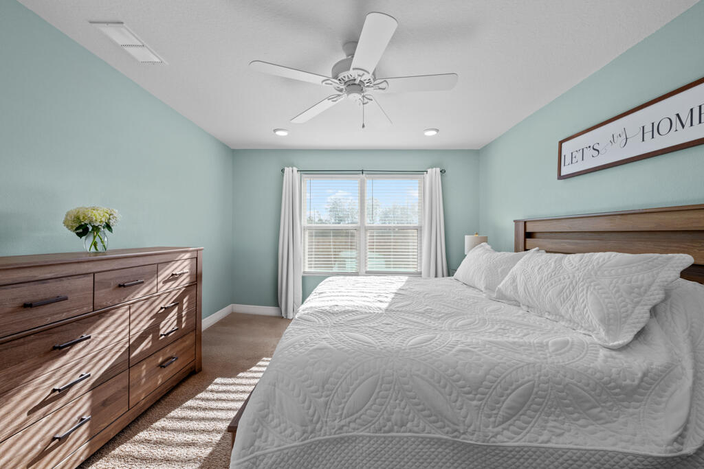 969 Merganser Way Crestview, FL 32539 - Photo 28 of 44 a bedroom with a bed and a window