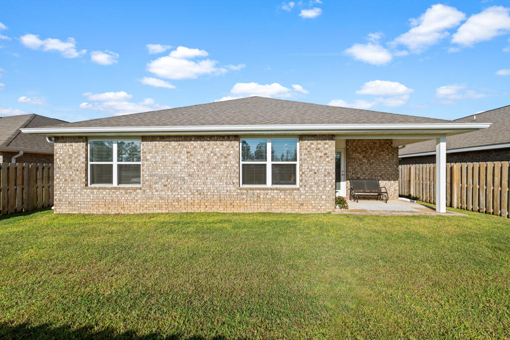 969 Merganser Way Crestview, FL 32539 - Photo 33 of 44 a view of a house with a yard and porch