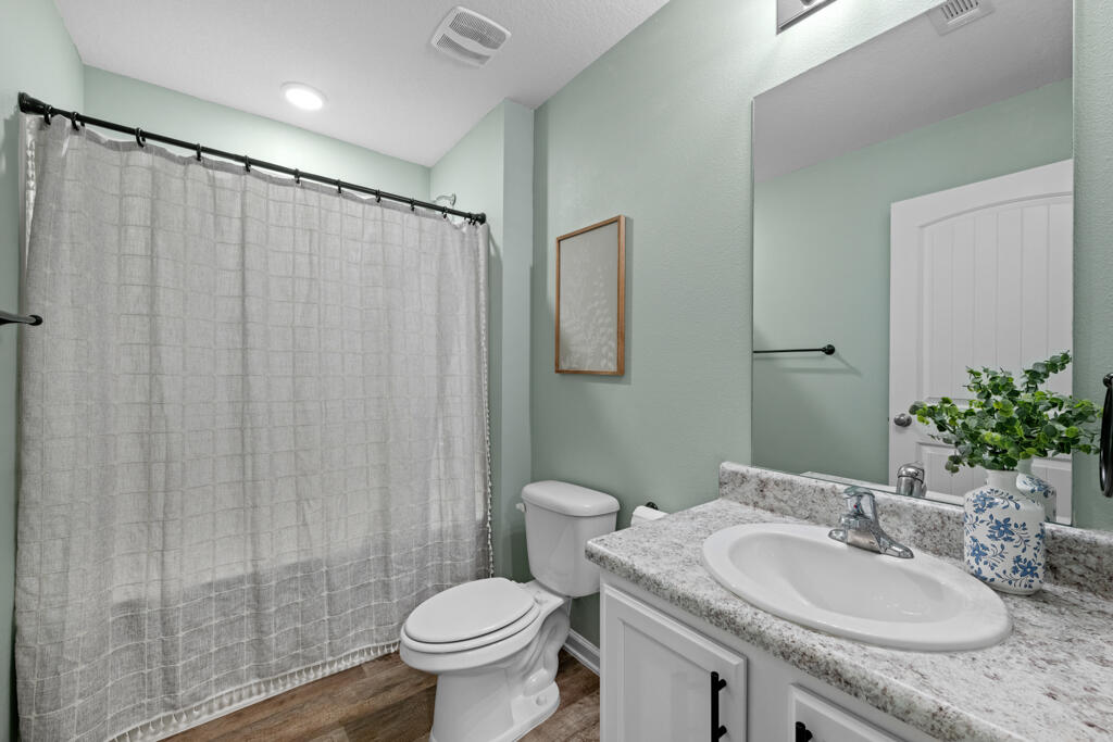 969 Merganser Way Crestview, FL 32539 - Photo 8 of 44 a bathroom with a granite countertop sink toilet and a mirror