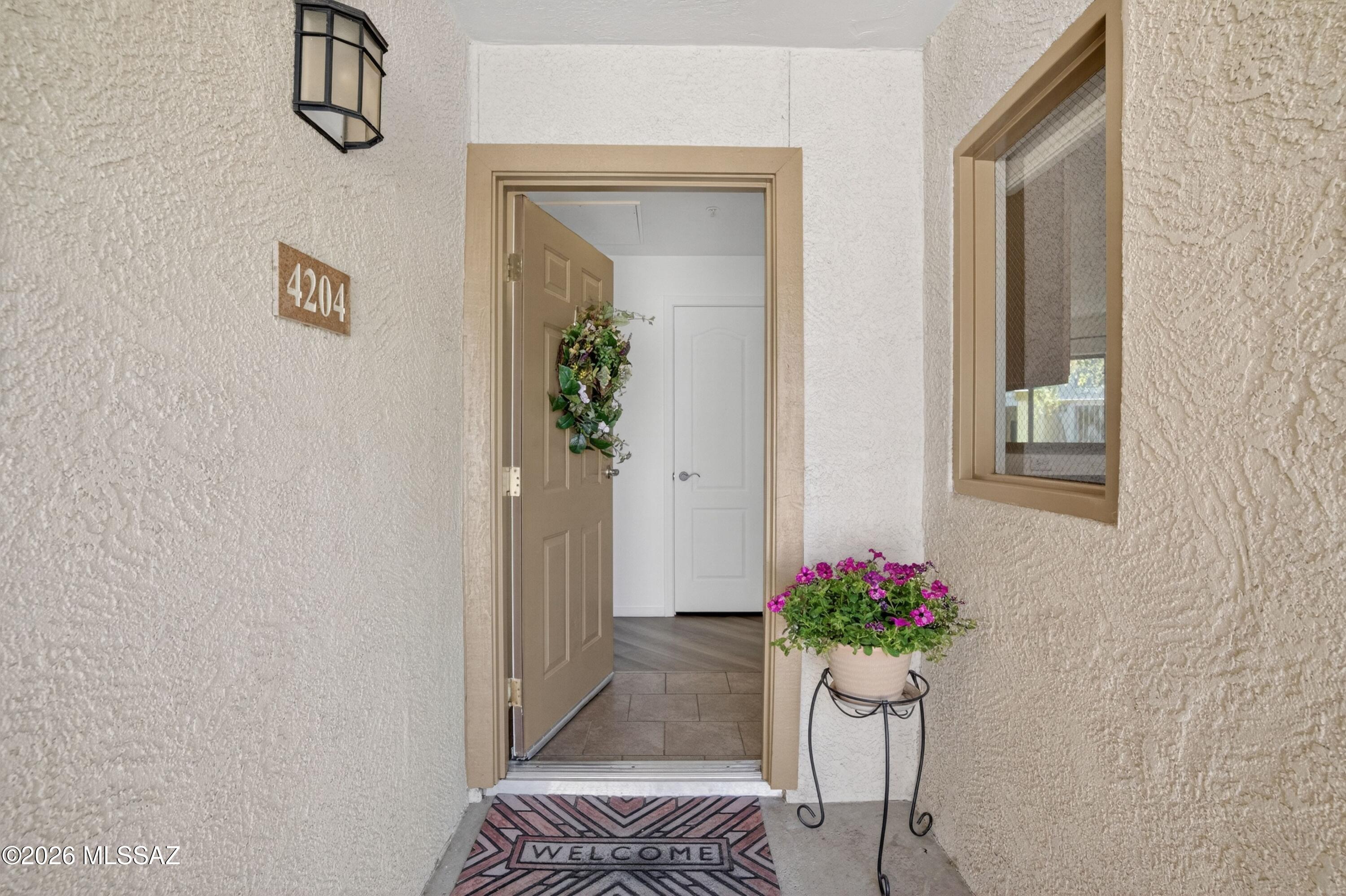 2550 East River Road, Unit 4204 Tucson, AZ 85718 - Photo 2 of 36 a view of hall way with furniture