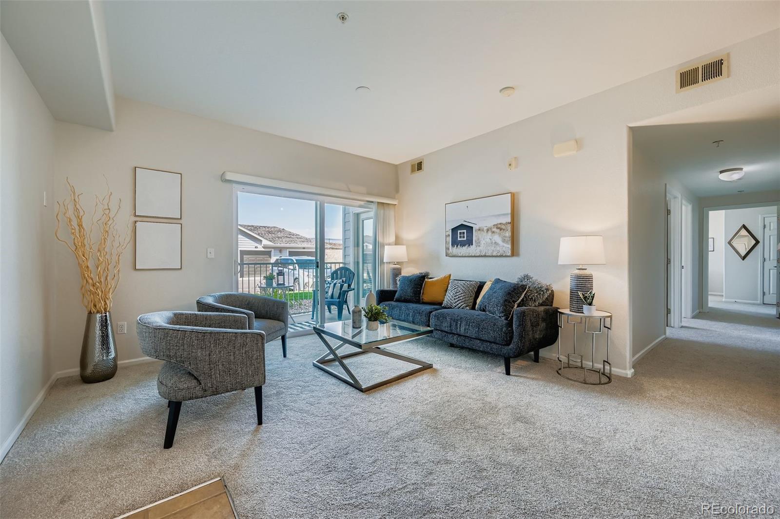 a living room with furniture and a window