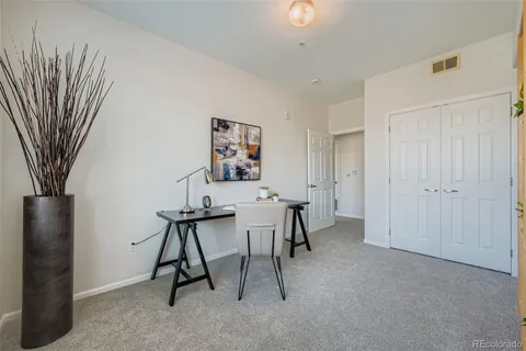 a view of a workspace with furniture