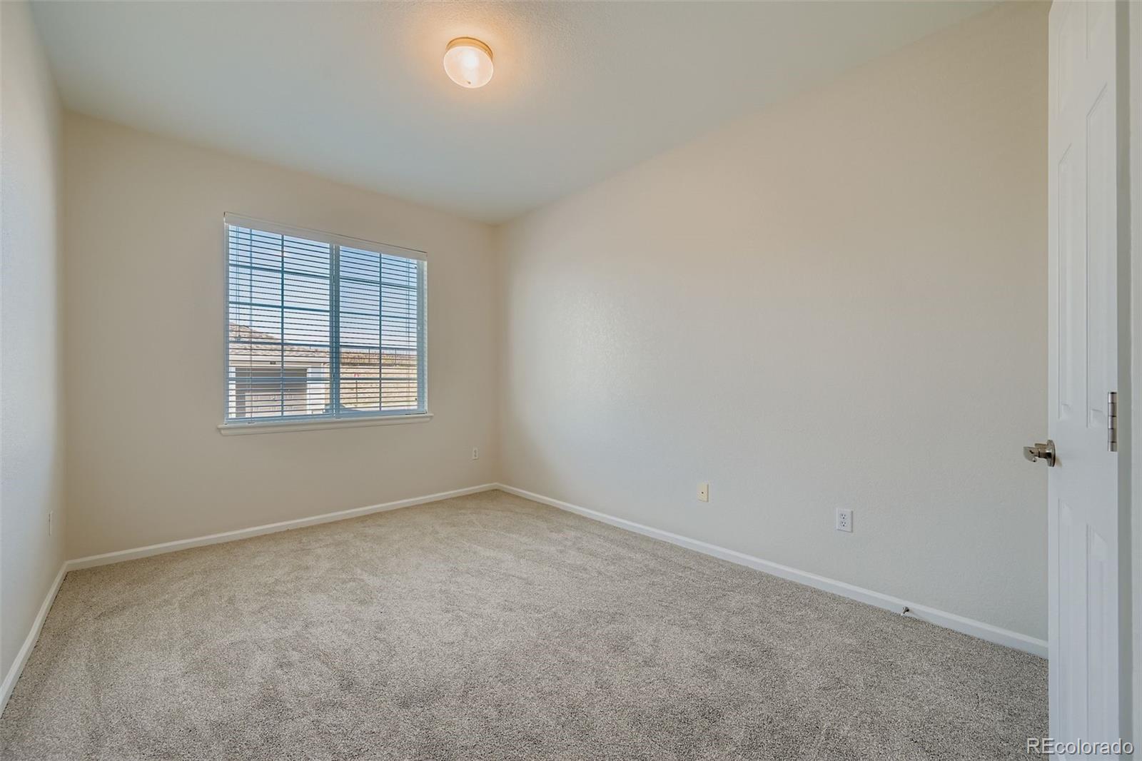 15700 East Jamison Drive, Unit 7101 Englewood, CO 80112 - Photo 18 of 31 an empty room with windows
