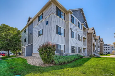 a view of a building with a yard