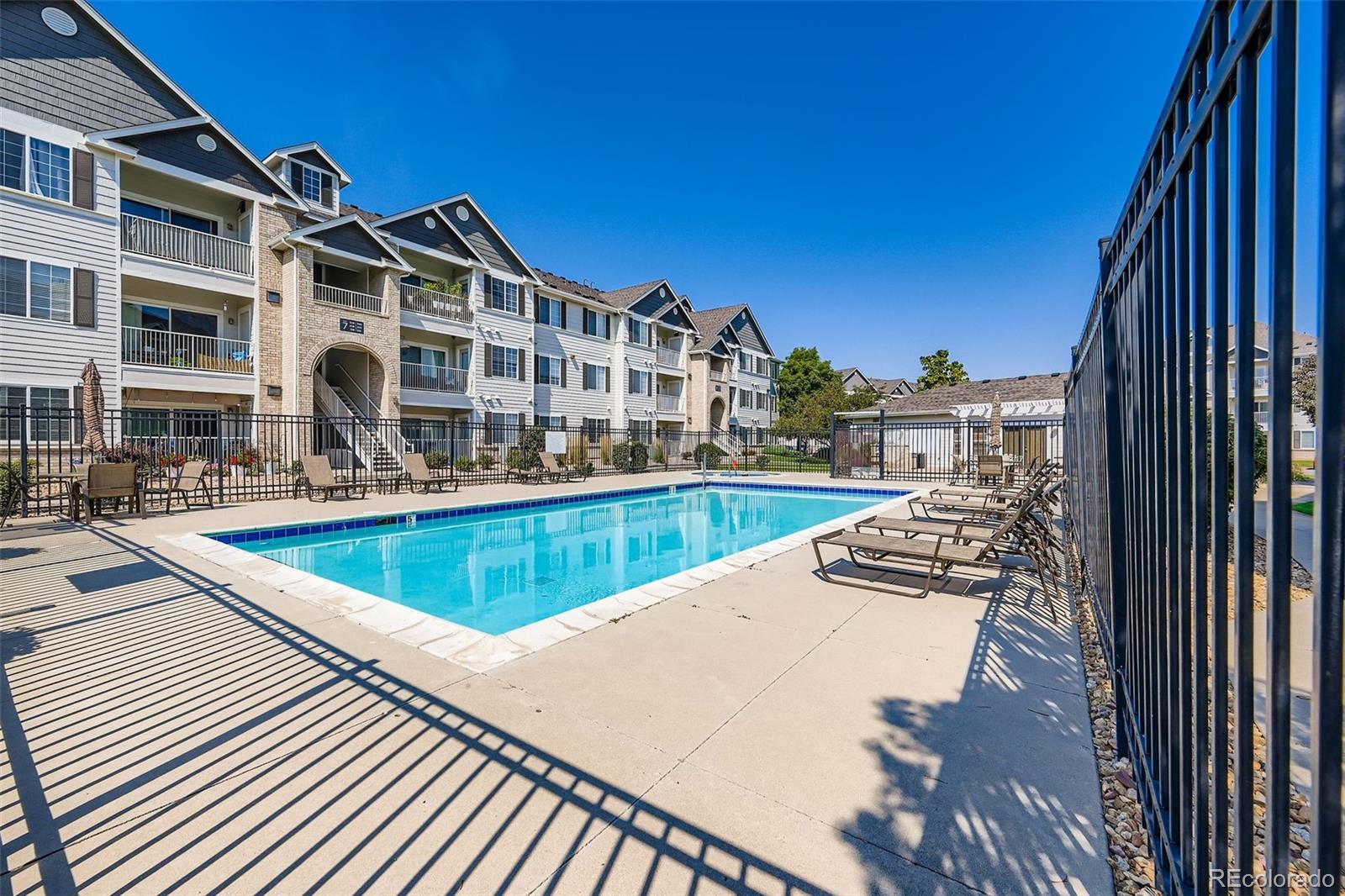 15700 East Jamison Drive, Unit 7101 Englewood, CO 80112 - Photo 27 of 31 a view of buildings with swimming pool