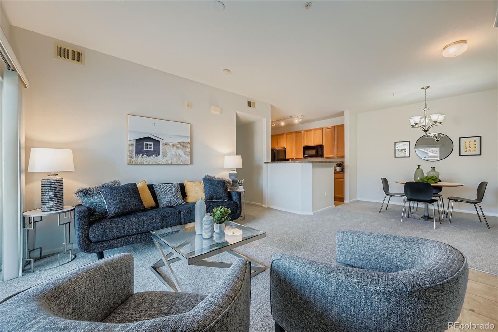 15700 East Jamison Drive, Unit 7101 Englewood, CO 80112 - Photo 3 of 31 a living room with furniture and a couch