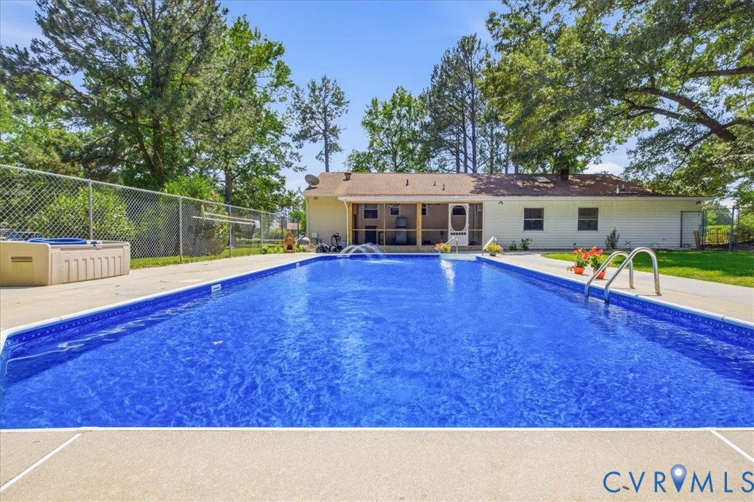 404 Bermuda Hundred Road Chester, VA 23836 - Photo 33 of 37 In-ground swimming pool with an integrated water f