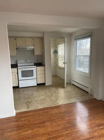 a kitchen with a stove and a refrigerator
