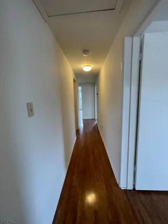 an empty room with wooden floor