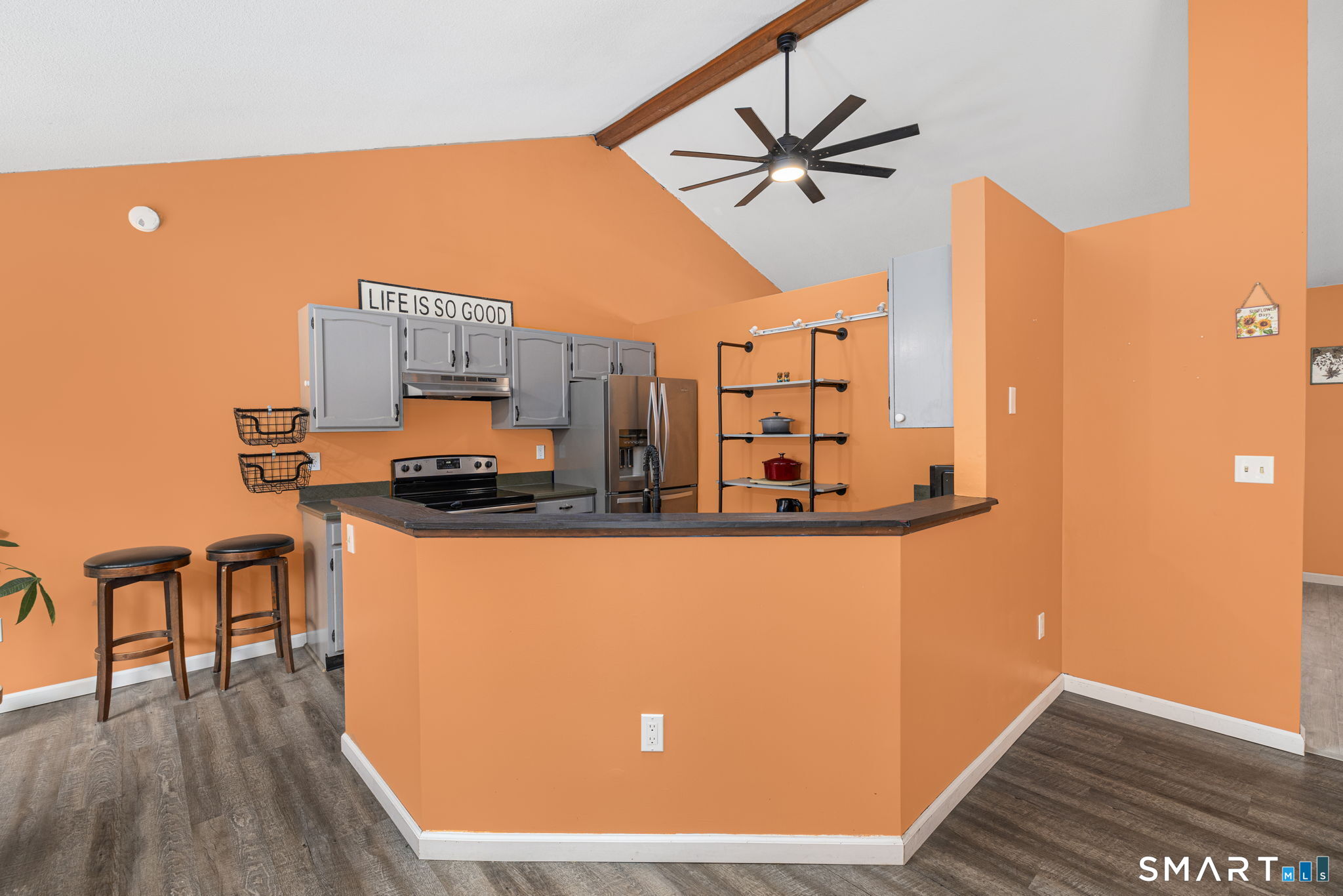 89 Kinney Hill Road Plainfield, CT 06374 - Photo 9 of 33 a living room with stainless steel appliances kitchen island granite countertop furniture a rug and a wooden floor
