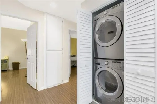 a view of a hallway with washer and dryer