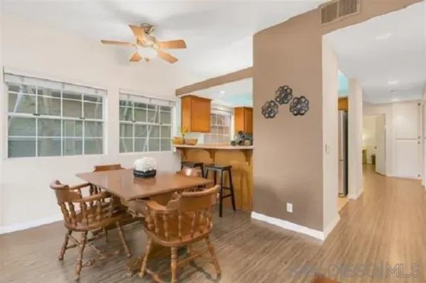 a view of a dining room with furniture and window