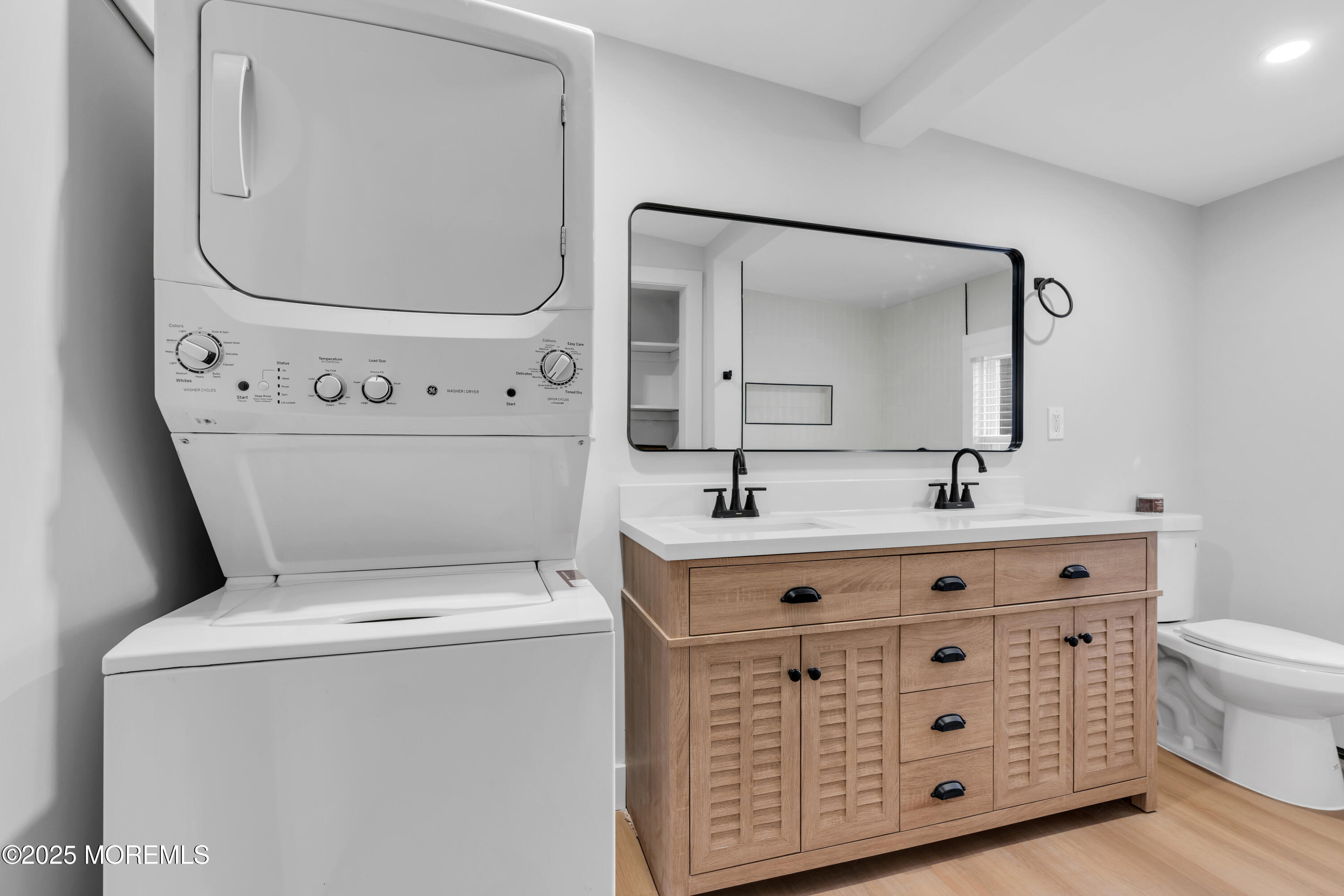 6 Orchard Street Matawan, NJ 07747 - Photo 21 of 45 a bathroom with a sink a toilet and a mirror