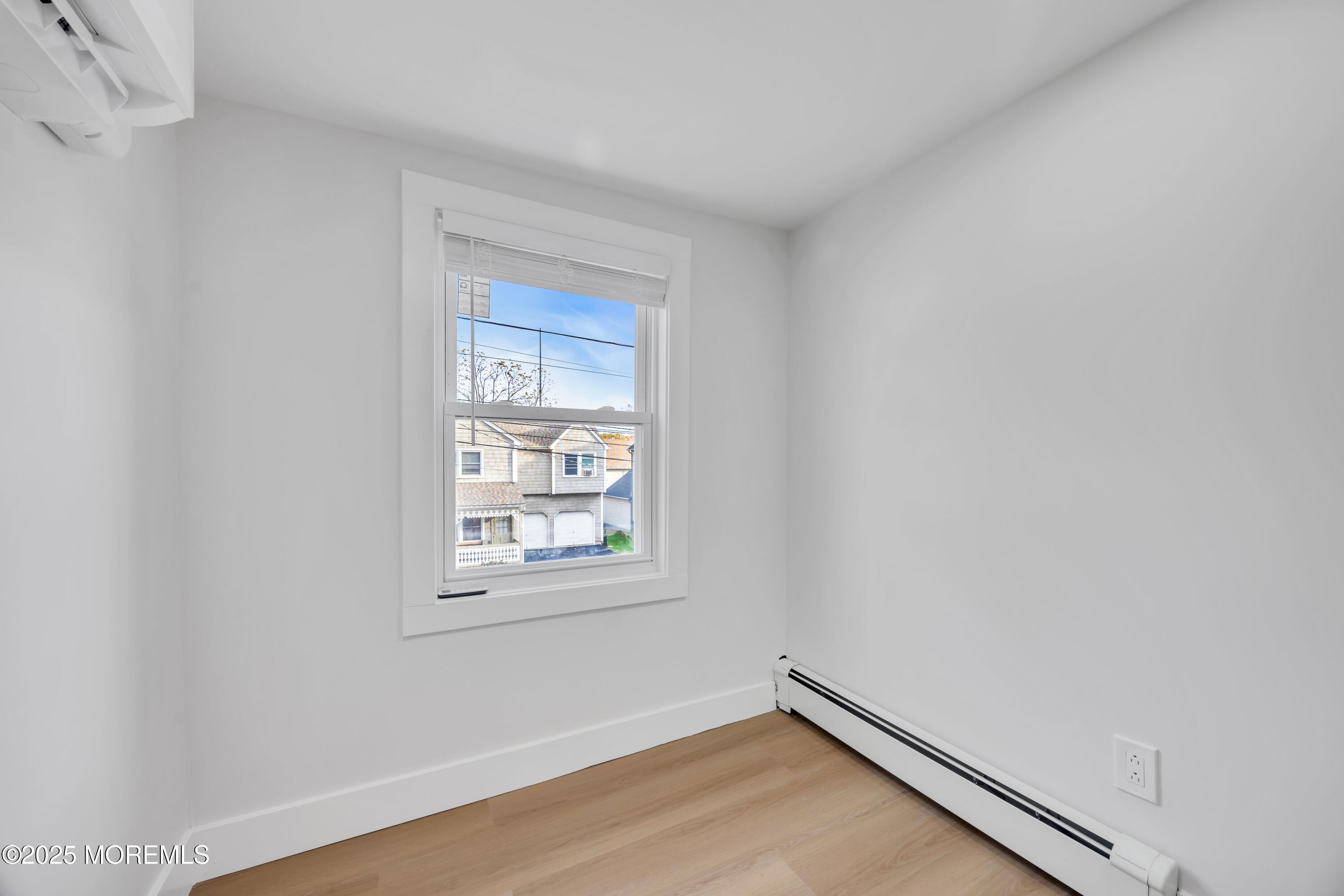 6 Orchard Street Matawan, NJ 07747 - Photo 29 of 45 a view of a room with wooden floor and a window