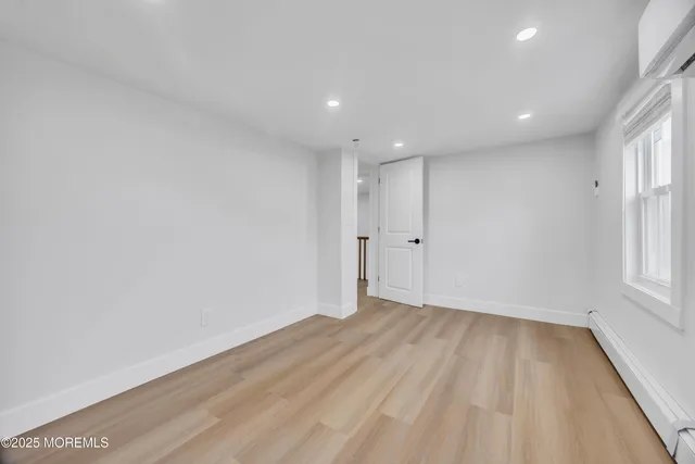 a view of a backyard with a garden and entertaining space